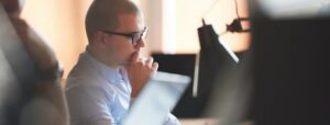 Businessman looking at computer monitor