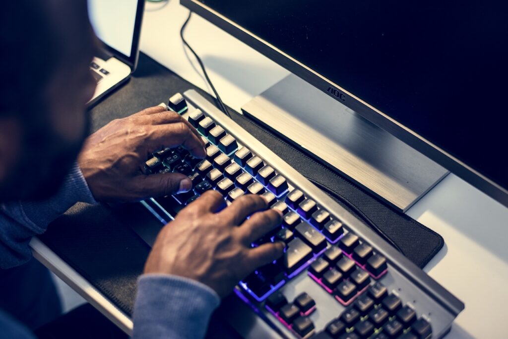 man at keyboard protecting from phishing