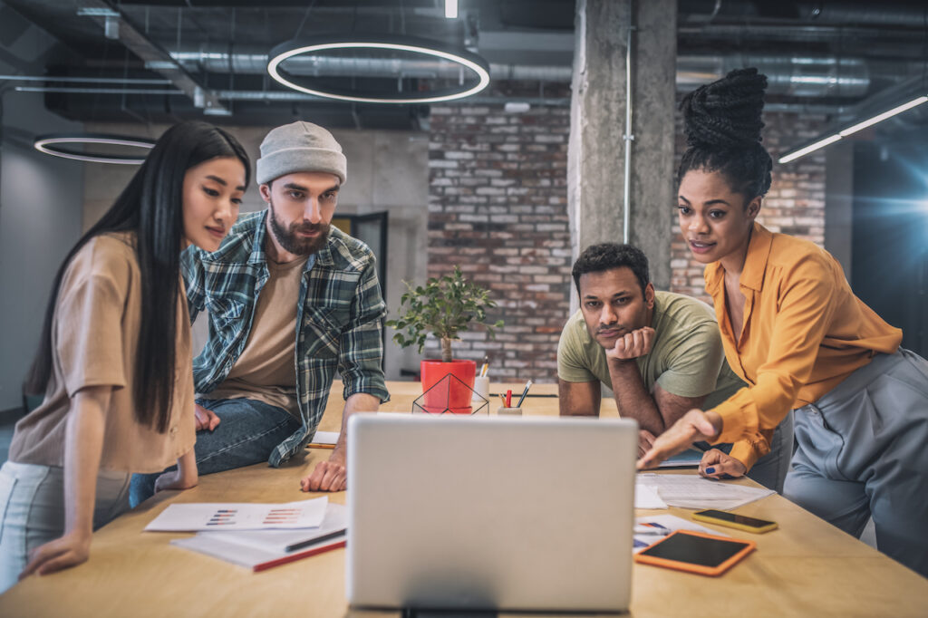 people looking at computer trying to get IT support