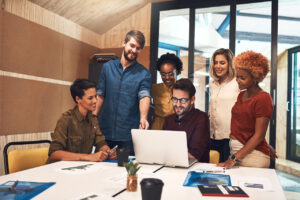 A group of business people looking at amazon workspace on computer